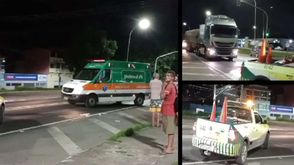Pedestre fica estado grave após ser atropelado e arremessado pela BR-101 na Serra Arte com 3 imagens, na primeira imagem uma ambulância parada na via, com moradores da região em volta, na segunda imagem um caminhão e uma viatura da ECO-101 que estava realizando a interdição da via, na terceira imagem, a viatura da ECO-101 com cones na caçamba