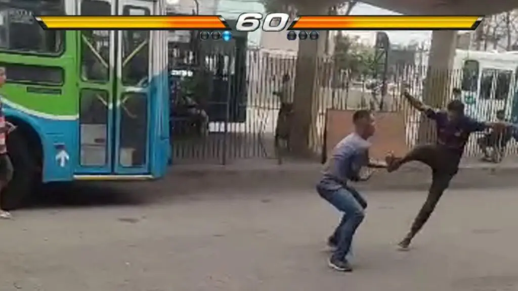 Vídeo: cenas do novo Street Fighter são gravadas no Terminal de Carapina Foto de dois homens lutando no meio do Terminal Carapina