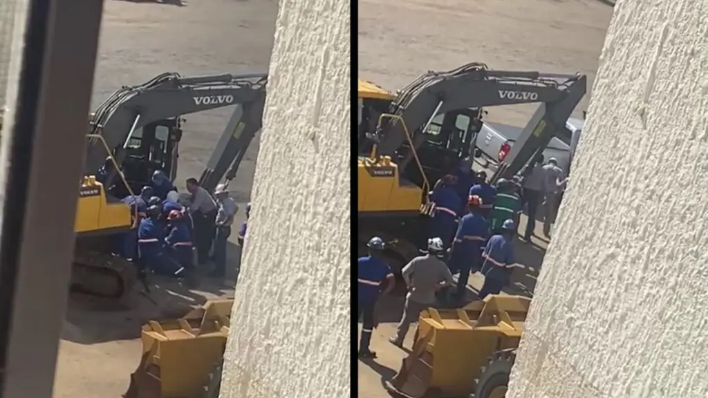 Vídeo: homem tem perna prensada por retroescavadeira e colegas ajudam no resgate Acidente de trabalho, um homem sofreu um acidente e foi prensado por uma retroescavadeira.