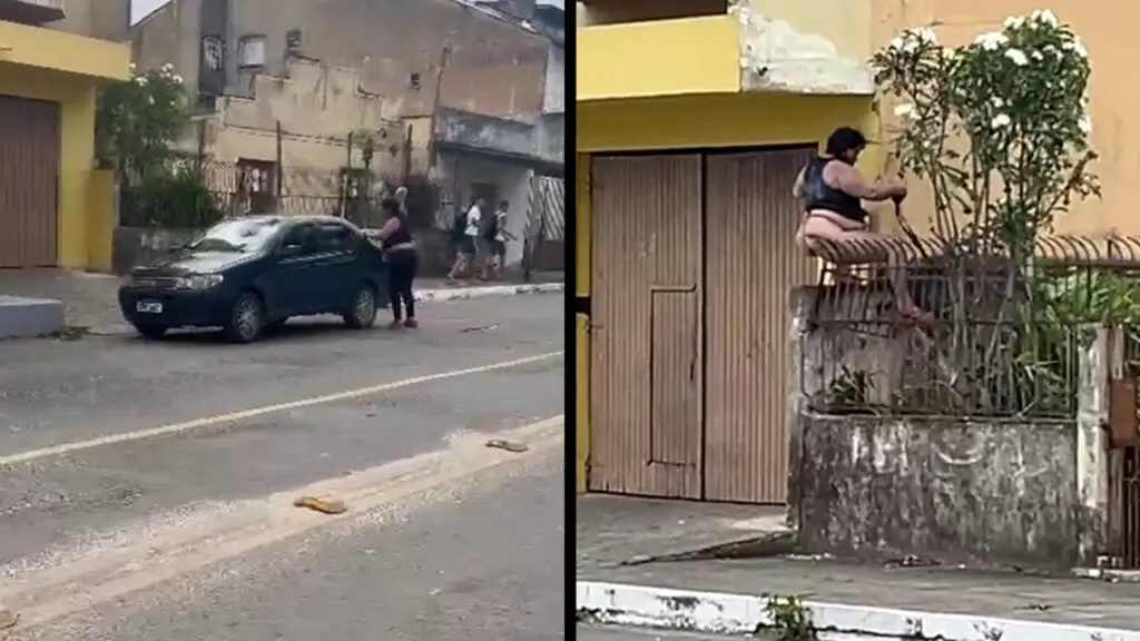 Vídeo: Mulher é flagrada danificando carro e depois pendurada em cima de muro em Nova Almeida Mulher aparentando estar em estado de surto causa confusão em Nova Almeida.