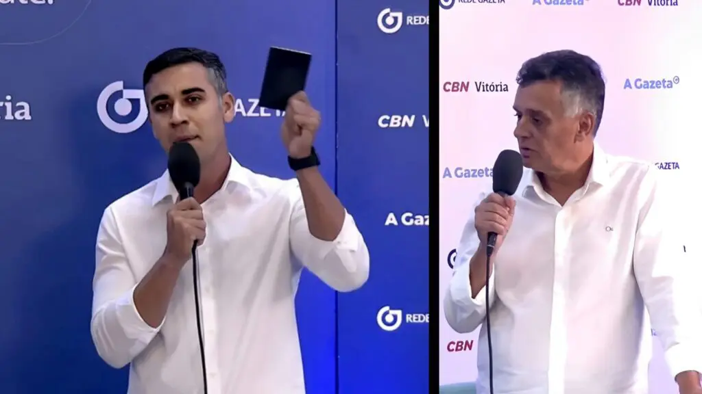 Weverson imita Pablo Marçal durante debate ao dar “carteirada de trabalho” em Audifax Weverson Meireles mostra a carteira de trabalho ao candidato Audifax Barcelos durante debate Gazeta/CBN Vitória