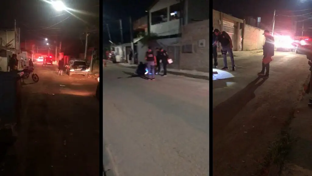 População observa movimentação da polícia em local de homicídio, em Jacaraípe, na Serra