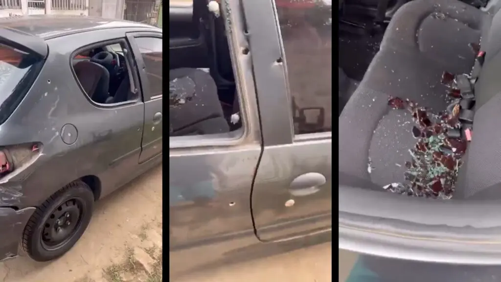 Carro da família atingido por disparos em ataque na Serra que matou menina de 6 anos, com vidros quebrados e marcas de tiros
