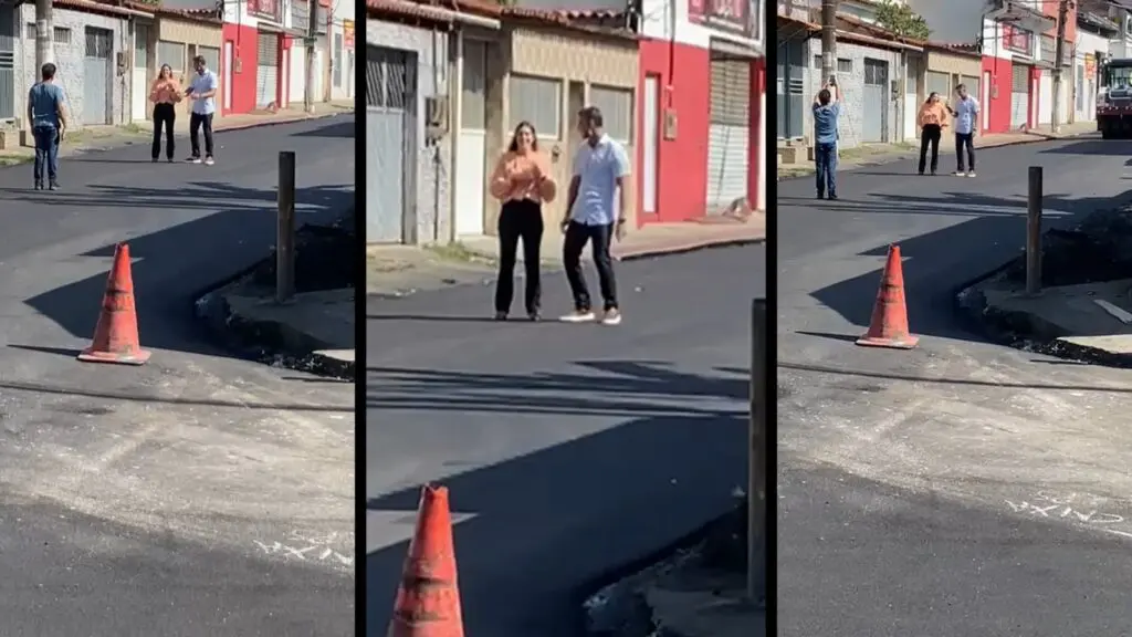 Prefeito da Serra, Weverson Meireles, se prepara para gravação de vídeo sobre obras do binário em rua do bairro Feu Rosa, ao lado da secretária Izabela Roriz.