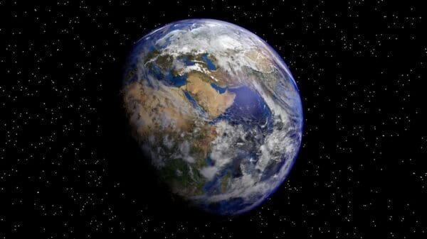 imagem do planeta terra e ao fundo várias estrelas.