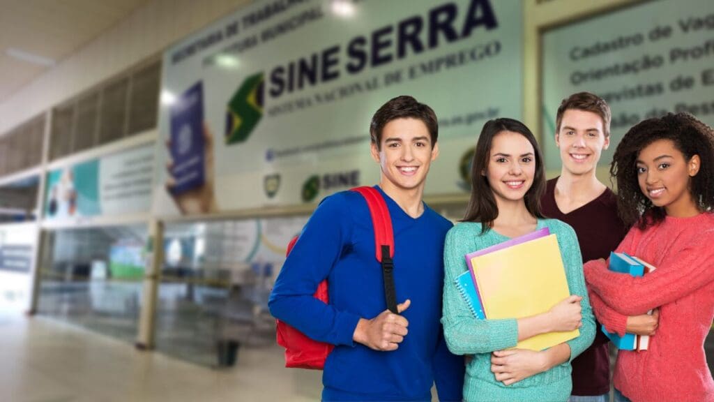 Foto com 4 alunos juntos e ao fundo desfocado uma agencia do SINE Serra