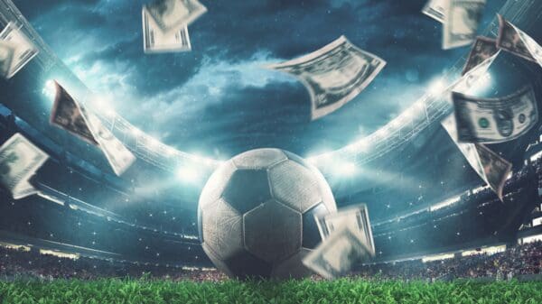 Foto bola de futebol com lucros obtidos em sites de apostas